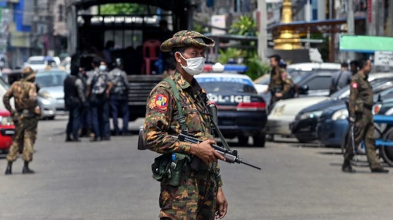 Junta soldiers patrol Yangon, May 7, 2021. AFP