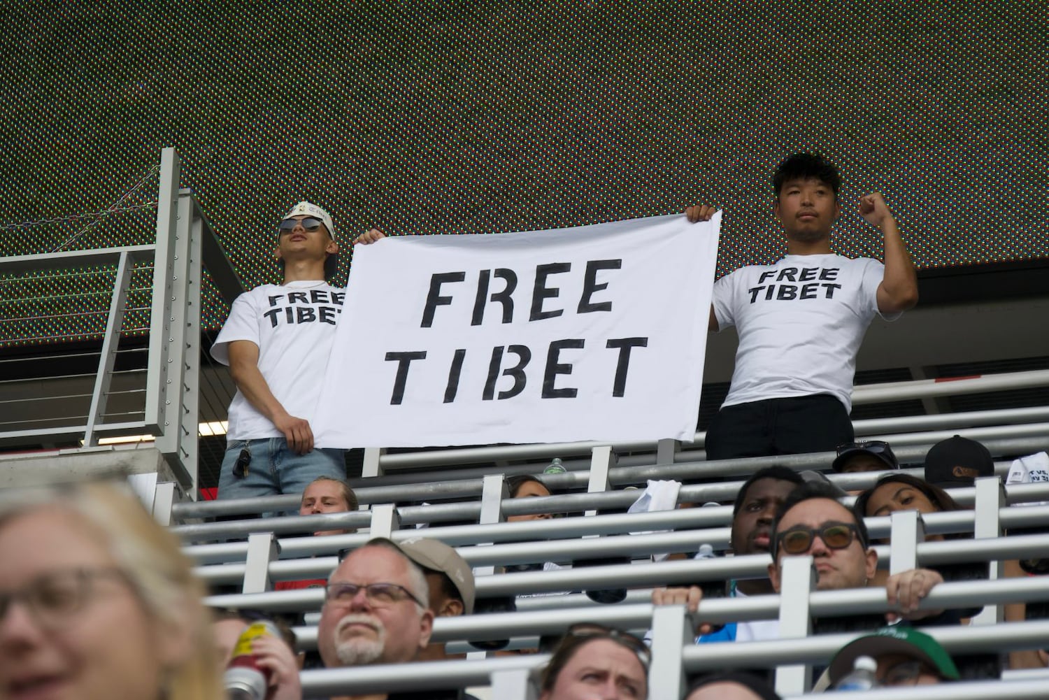 Tibetans evicted then reinstated after protest at US-China women’s soccer match