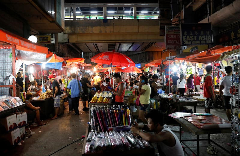 In a file photo, vendors sell their wares at a local downtown district of Metro Manila, Philippines, September 15, 2017.