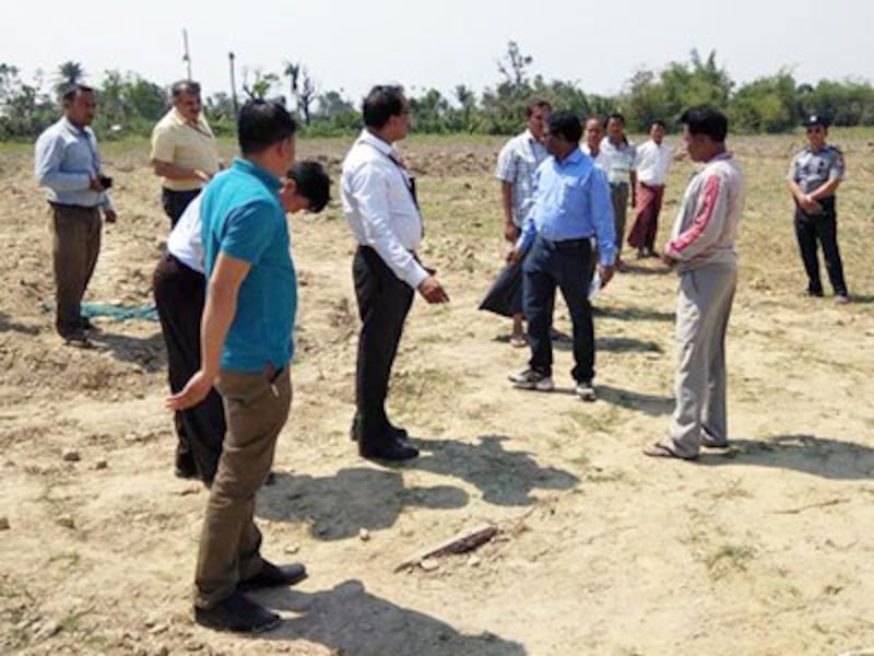 Diplomats from the Indian embassy in Myanmar survey land where their government will build homes for ethnic minorities in Maungdaw township in western Myanmar's Rakhine state, Feb. 10, 2018.