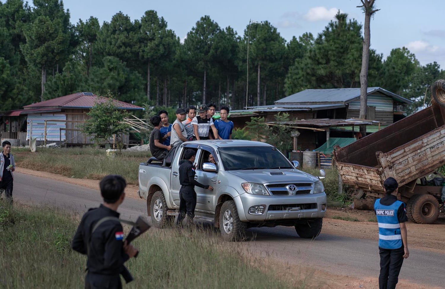 A KSP Station 8 officer chats with a driver at a checkpoint in southern Shan state, Myanmar, Nov. 4, 2024.