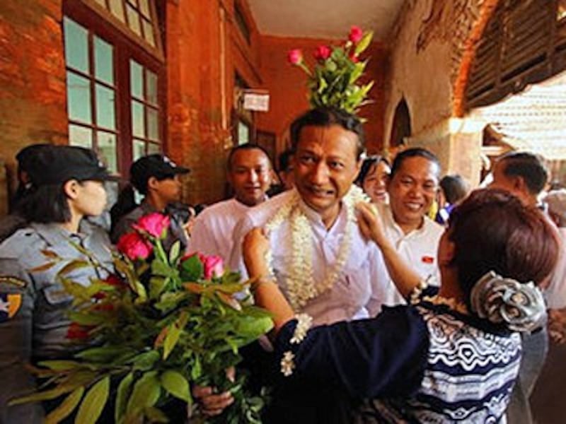 A freed student greets a family member in Tharrawaddy, central Myanmar's Bago region, April 8, 2016.