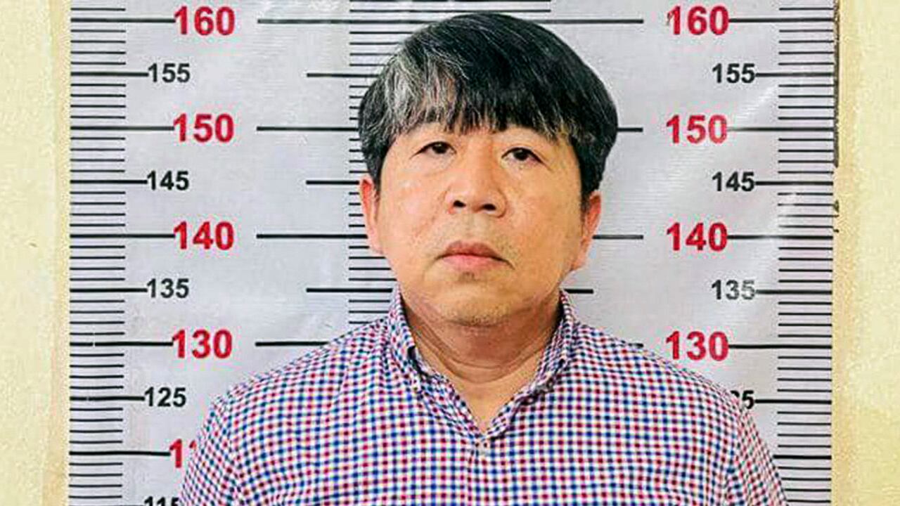 Srey Sina in an undated police booking phot