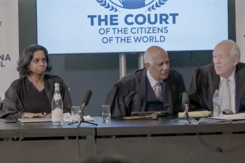 Judges Bhavani Fonseka (L) and Zak Yacoob (C) and presiding judge Stephen Rapp hold court during the China Tribunal at the Court of the Citizens of the World in The Hague, the Netherlands, July 12, 2024. (Court of the Citizens of the World via YouTube)
