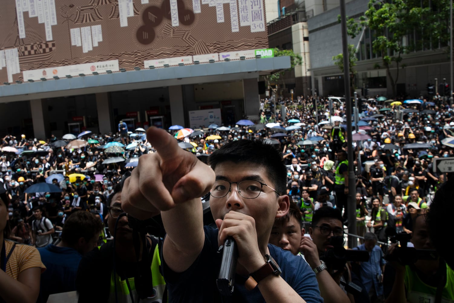 Hong Kong protest leader Joshua Wong, 22, speaks as thousands of protesters surround the police headquarter in Hong Kong on June 21, 2019. (Paula Bronstein/Getty Images )