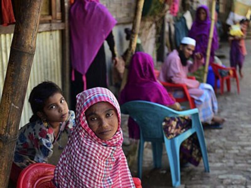 Myanmar Rohingya refugees sit in a refugee camp in Teknaf in Bangladesh's Cox's Bazar, Nov. 26, 2016. 