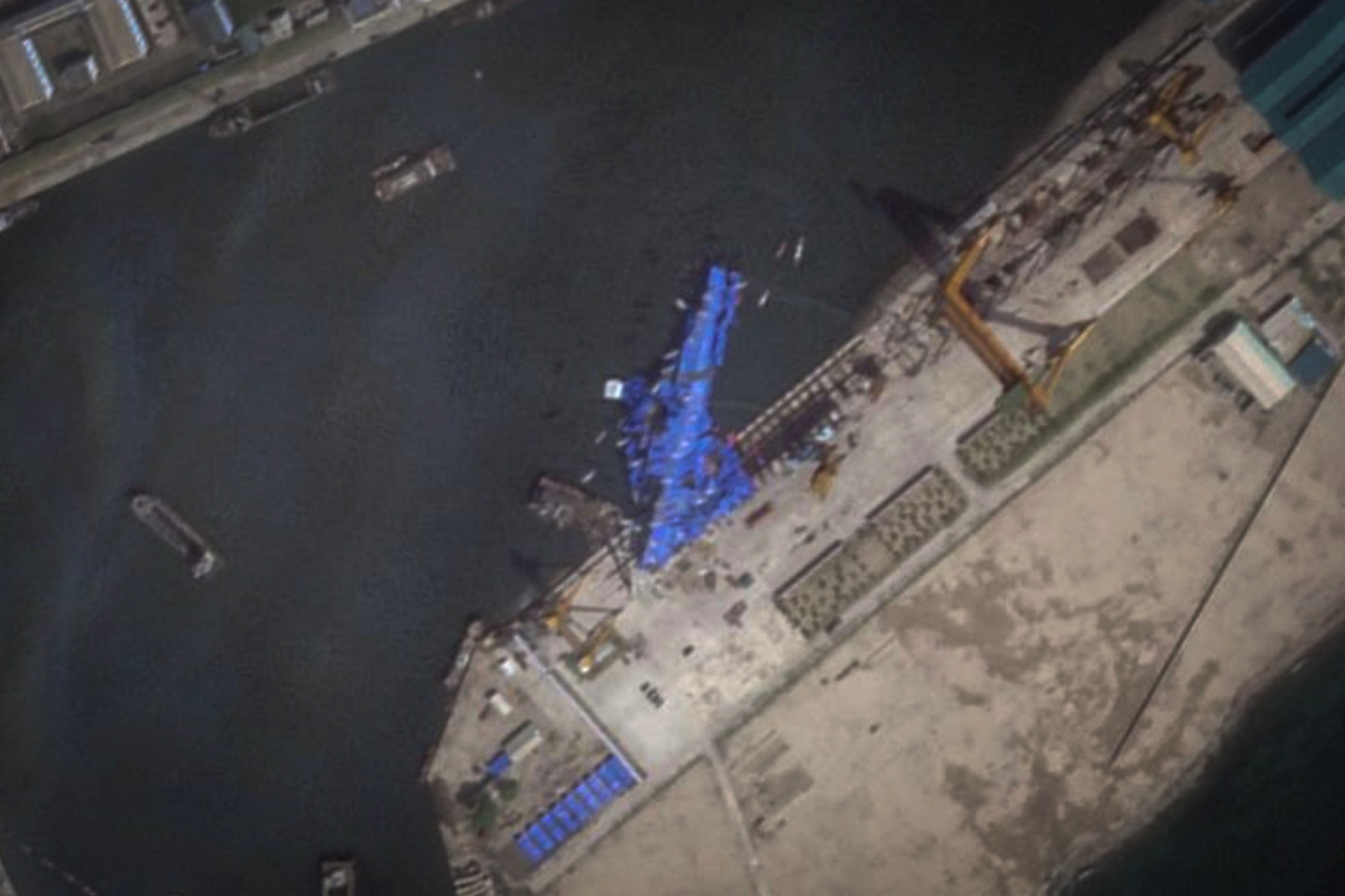 This May 23, 2025, satellite image from Planet Labs PBC shows a blue tarp covering a North Korean destroyer after it suffered a failed launch while it was being put to sea in Chongjin, North Korea.