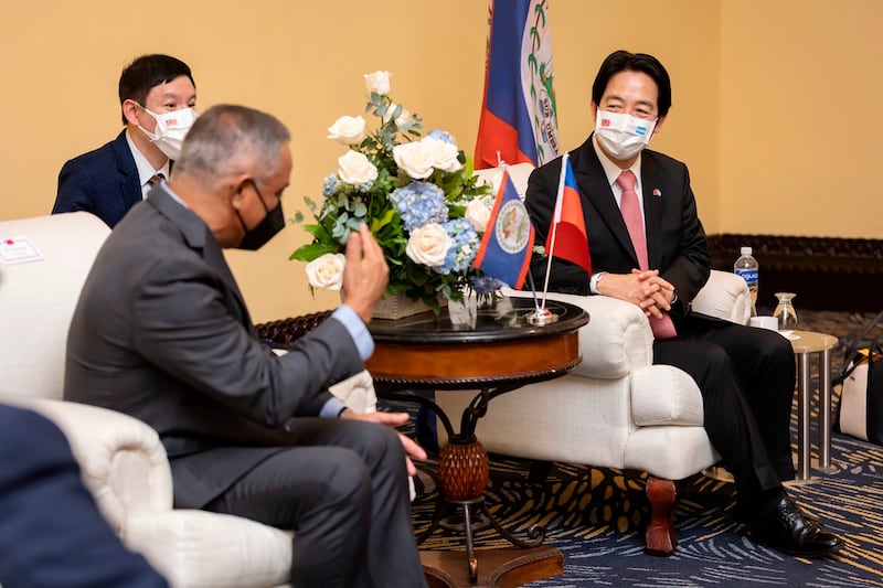 Belize's Prime Minister Johnny Briceno, left, meets with Taiwan's Vice President Lai Ching-te in Honduras, Jan. 27, 2022.