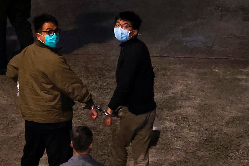 前香港眾志秘書長黃之鋒(右)及前主席林朗彥(左),被判監1年至7個月不等。(路透社資料圖片)