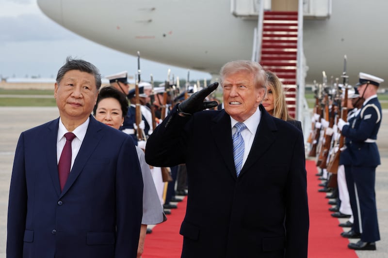U.S. President Donald Trump salutes next to Chinese President Xi Jinping at Joint Base Andrews, Maryland, Sept. 23, 2026.