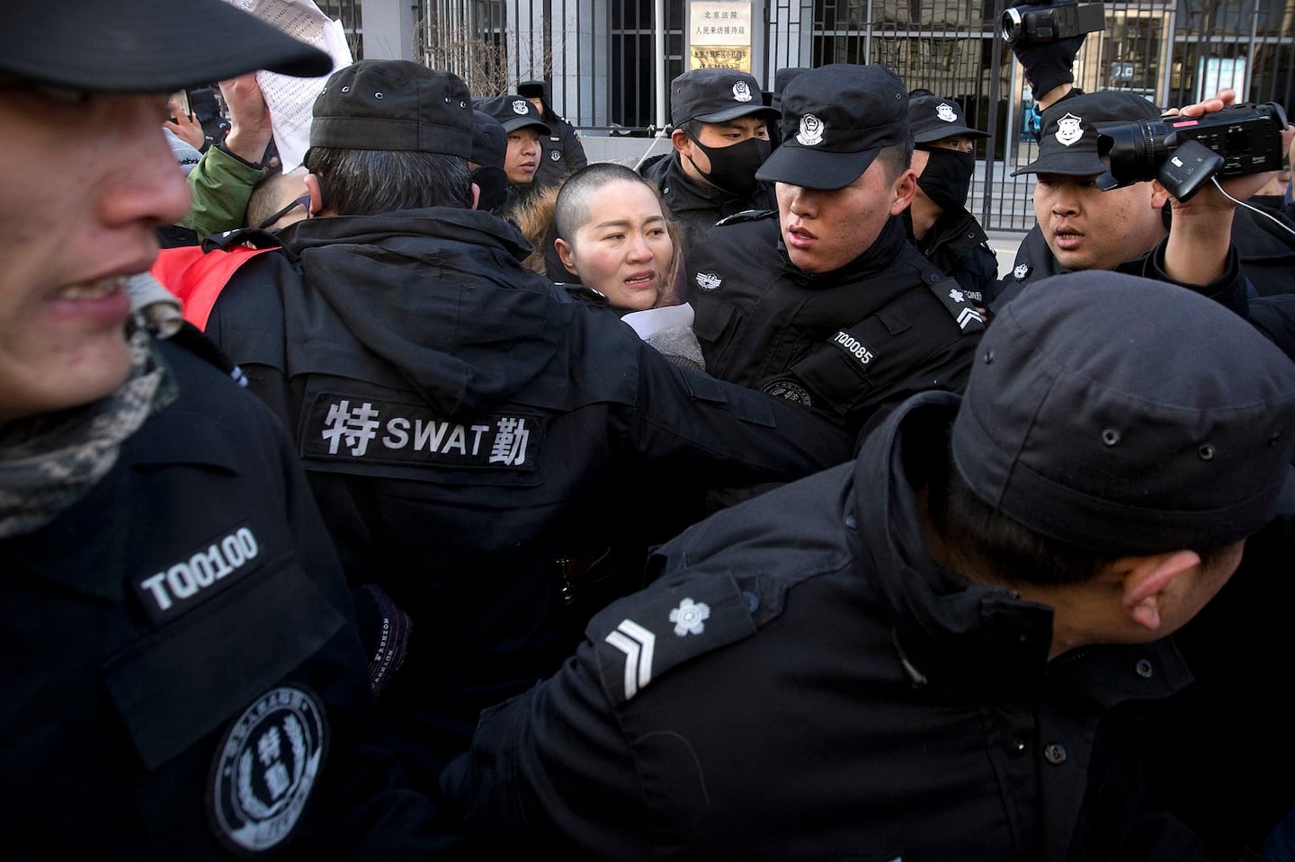 Rights lawyer, activist wife forced from Beijing home ...