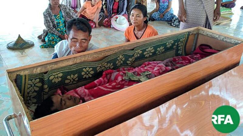 Relatives of Hla Maung Win hold a funeral for the deceased farm worker in Mrauk-U township, western Myanmar's Rakhine state, March 14, 2019.