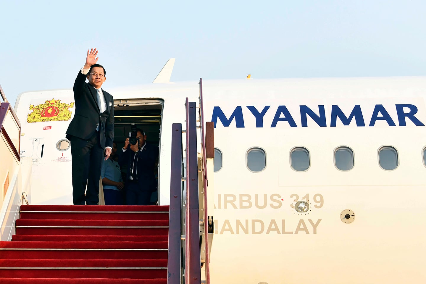 Myanmar junta chief Senior Gen. Min Aung Hlaing waves as he departs from Naypyidaw International Airport en route to Russia, March 3, 2025.