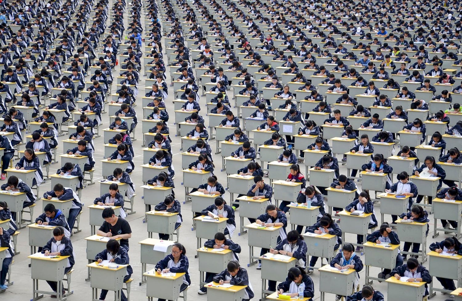 Students take an examination on an open-air playground at a high school in Yichuan, Shaanxi province April 11, 2015. (Reuters)