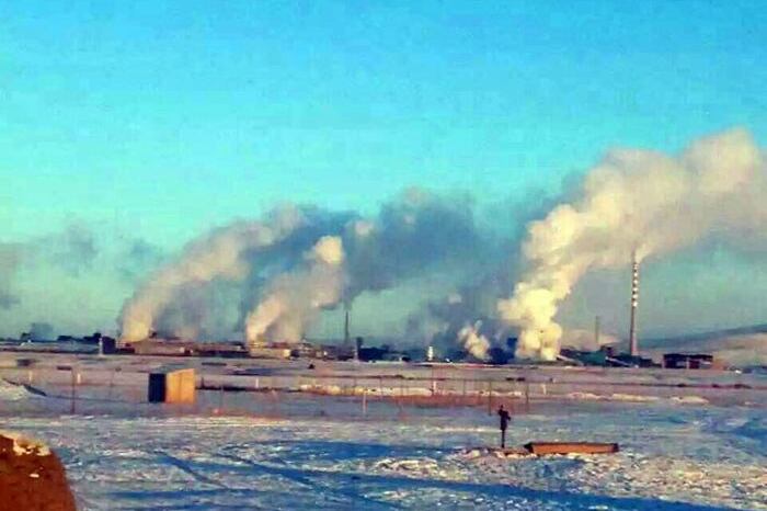 This undated file photo shows exhaust gas rising from the Xing'an copper-zinc smelter in Inner Mongolia.
