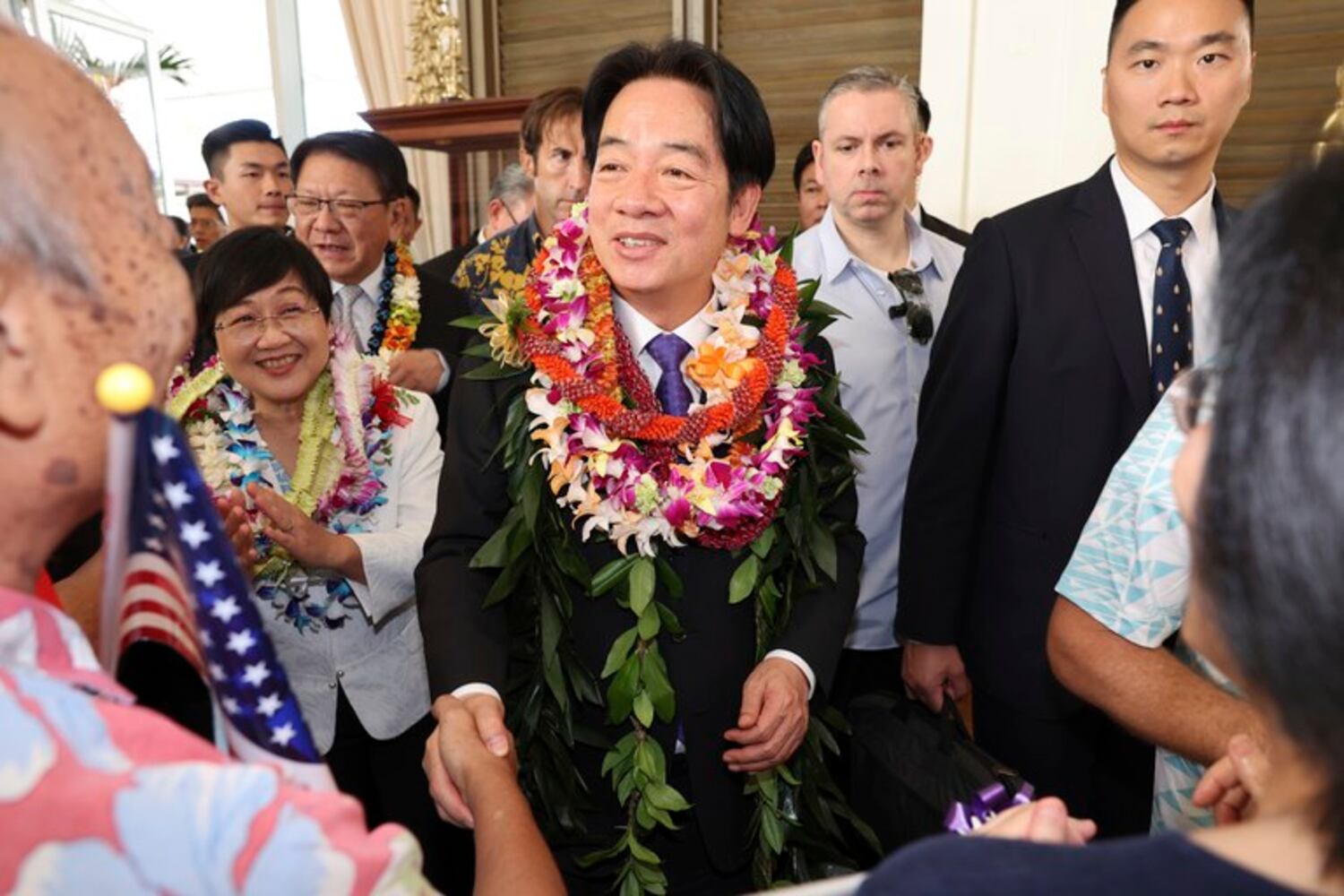 Taiwan President Lai Ching-te (center) greets people at a hotel in Honolulu at the start of his Pacific visit including to Palau, Marshall Islands and Tuvala.
