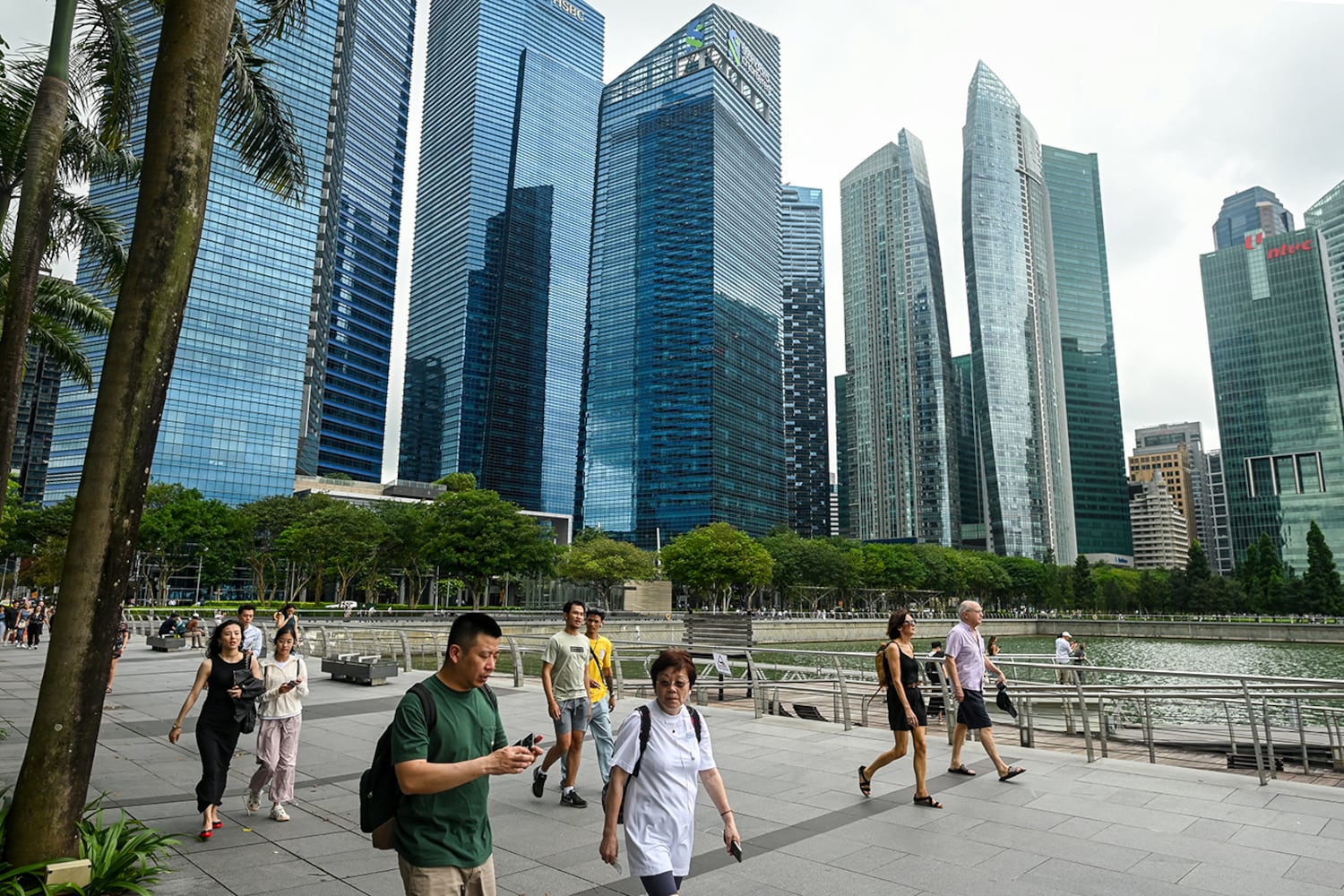 People walk along the promenade at Marina Bay in Singapore on Jan. 27, 2025.