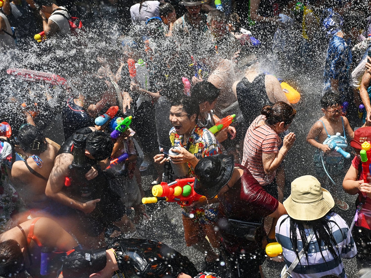 Revelers take part in mass water fights on the first day of Songkran, or Thai New Year, in Bangkok on April 13, 2024.