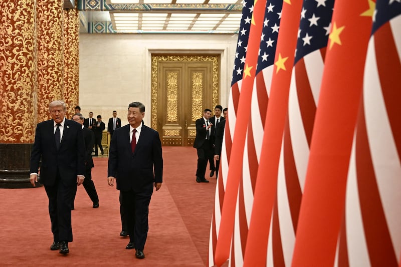 China's President Xi Jinping, right, and U.S. President Donald Trump arrive to attend a state banquet at the Great Hall of the People in Beijing on May 14, 2026.