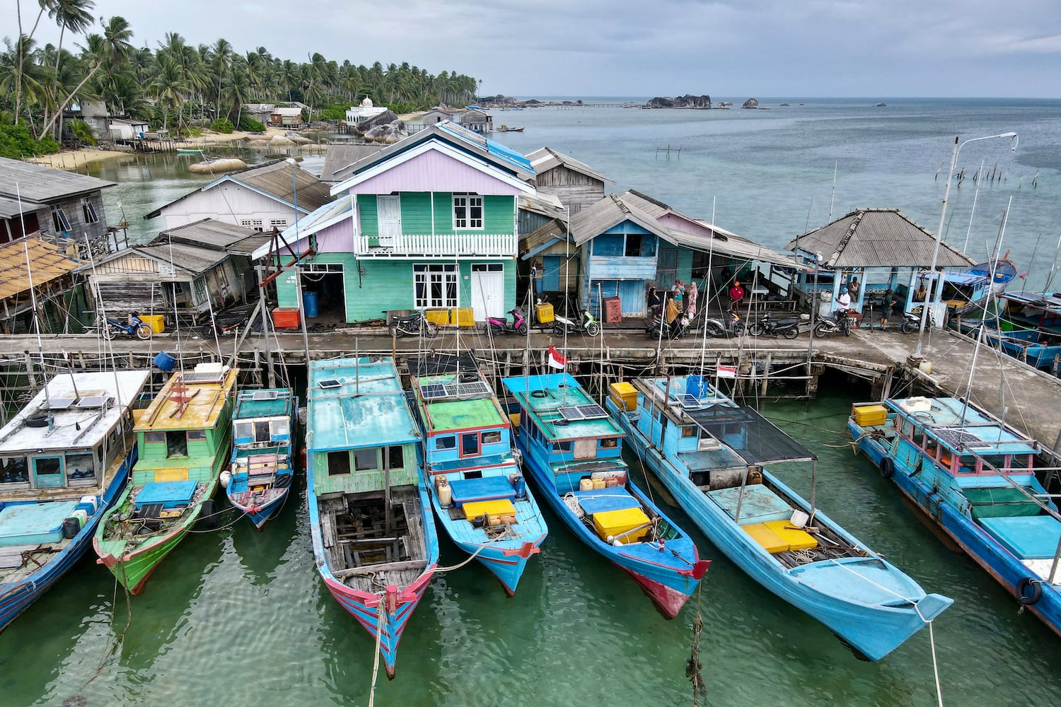 Fishing boats and houses at Baruk Bay port on Natuna island, in Riau Islands province, on Sept. 22, 2023.
