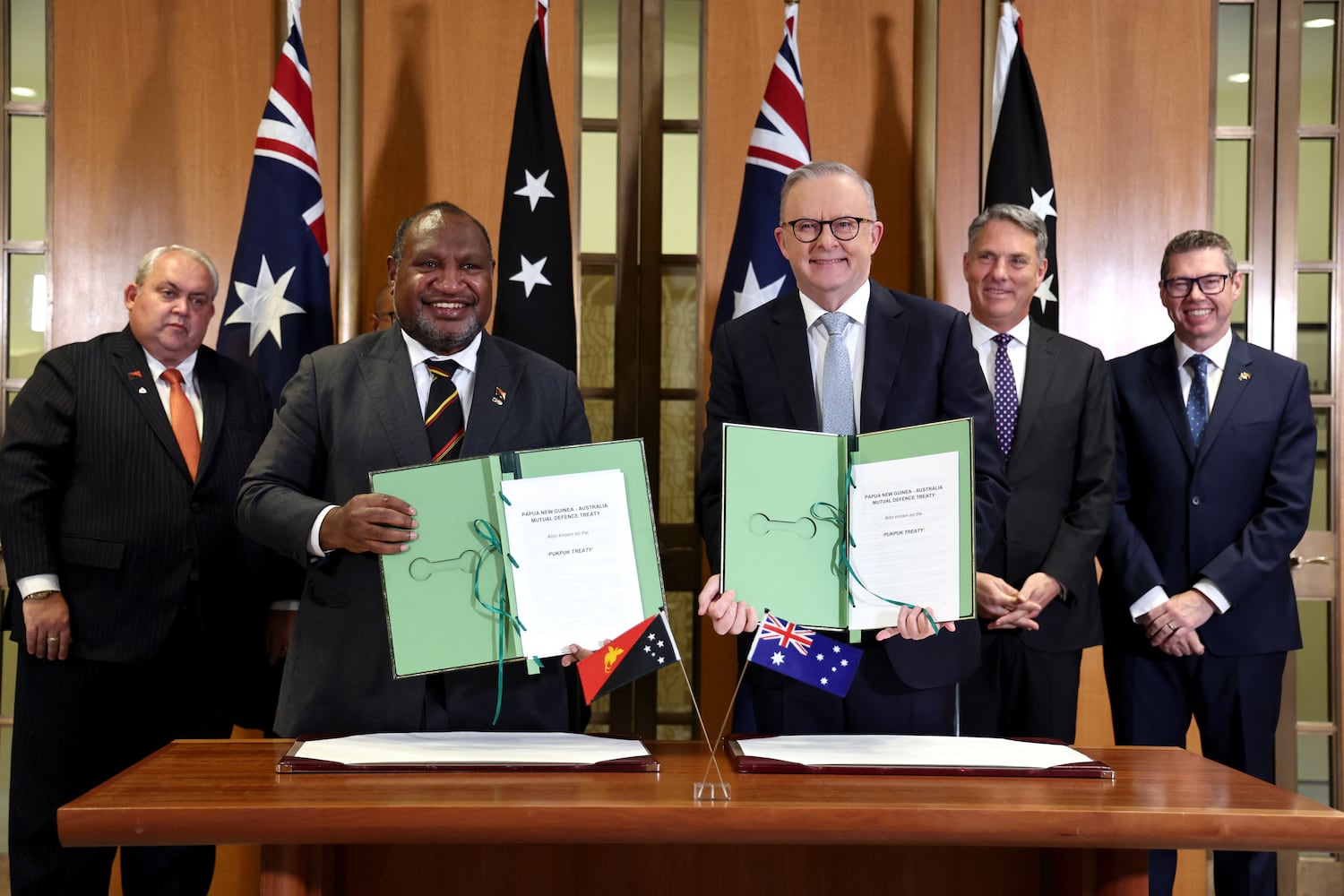 Australia's Prime Minister Anthony Albanese and Papua New Guinea's Prime Minister James Marape and other officials after the signing of the Pukpuk treaty at Parliament House in Canberra on Oct. 6, 2025.