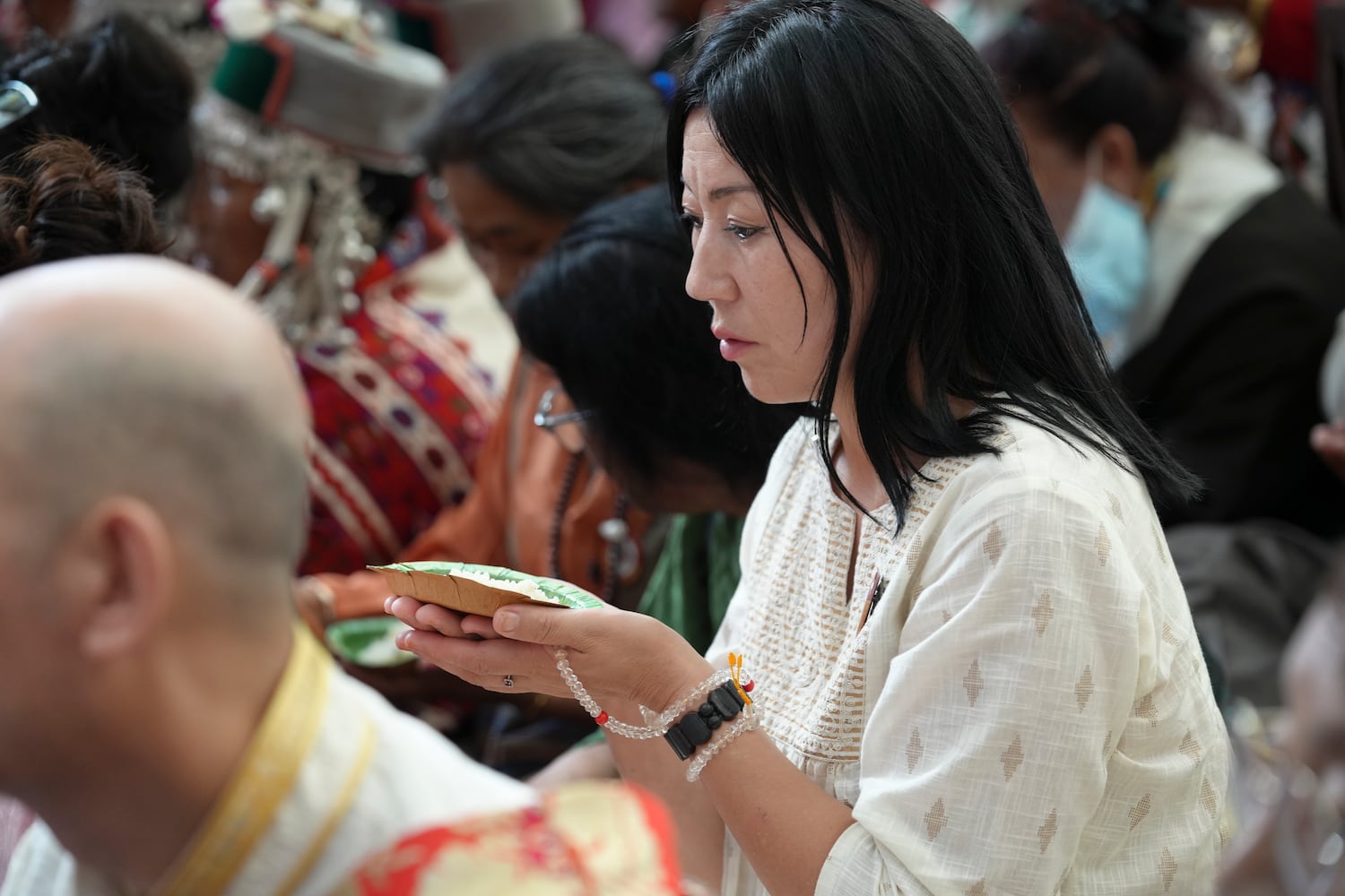 A devotee listens during celebrations on the 90th birthday of the Dalai Lama at the Main Temple in Dharamsala, India, July 6, 2025.