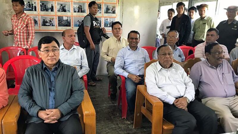 Bangladesh's Foreign Minister Abdul Hassan Mahmood Ali (front row, 2nd from R) sits in an office during a visit to western Myanmar's Rakhine state, Aug. 11, 2018.