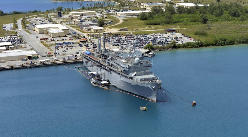 This image obtained from the US Department of Defense shows the submarine tender USS Emory S. Land and the Los Angeles-class attack submarine USS Topeka pierside in their home port at Polaris Point, Guam, on April 19, 2017.