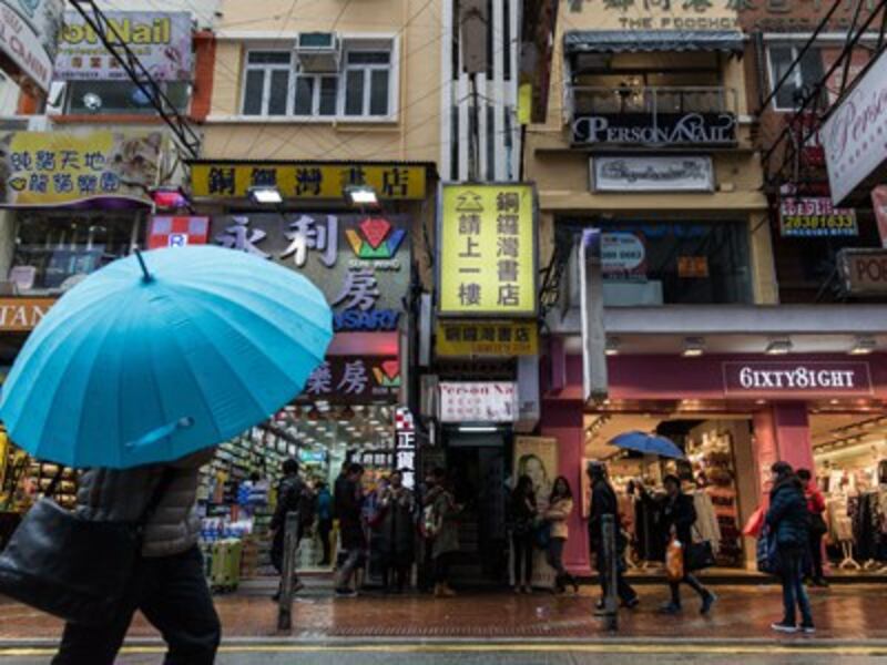 Journalists wait outside a building entrance (bottom C) leading up to the Causeway Bay Books store which sells books on Chinese politics in Hong Kong, Feb. 1, 2016.