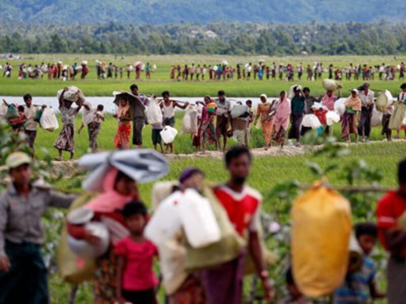 Rohingya refugees from Myanmar walk to refugee camps in Palang Khali near Cox's Bazar in southeastern Bangladesh, Oct. 19, 2017.
