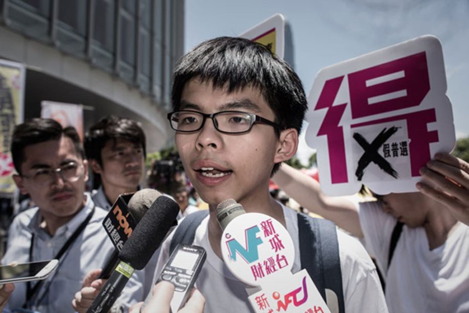 Joshua Wong speaks to the media after a vote at the city's legislature in Hong Kong, June 18, 2015.