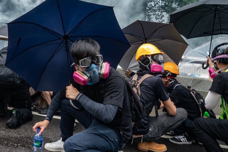 Protesters standoff with police in cloud of tear gas during a clash at an anti-government rally outside of Central Government Complex on August 31, 2019 in Hong Kong.