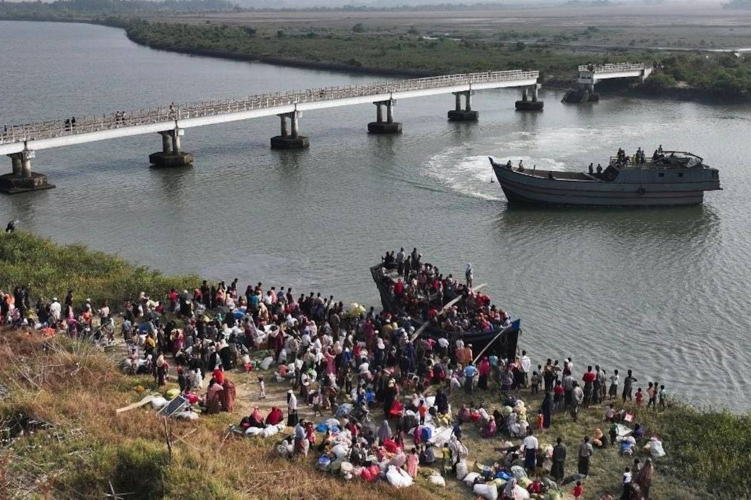 Internally displaced people board a boat for their return to Myanmar's Maungdaw town in an undated photograph taken in January.