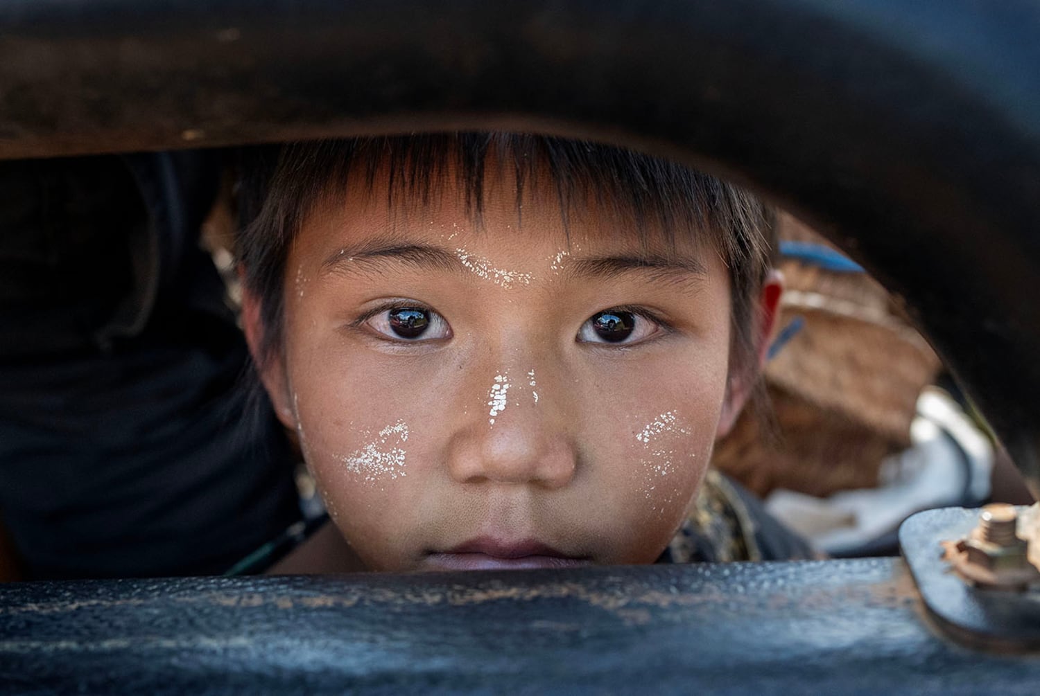 A child fleeing Phuk Khe village looks out from a vehicle in southern Shan state, Myanmar, Oct. 30, 2024.