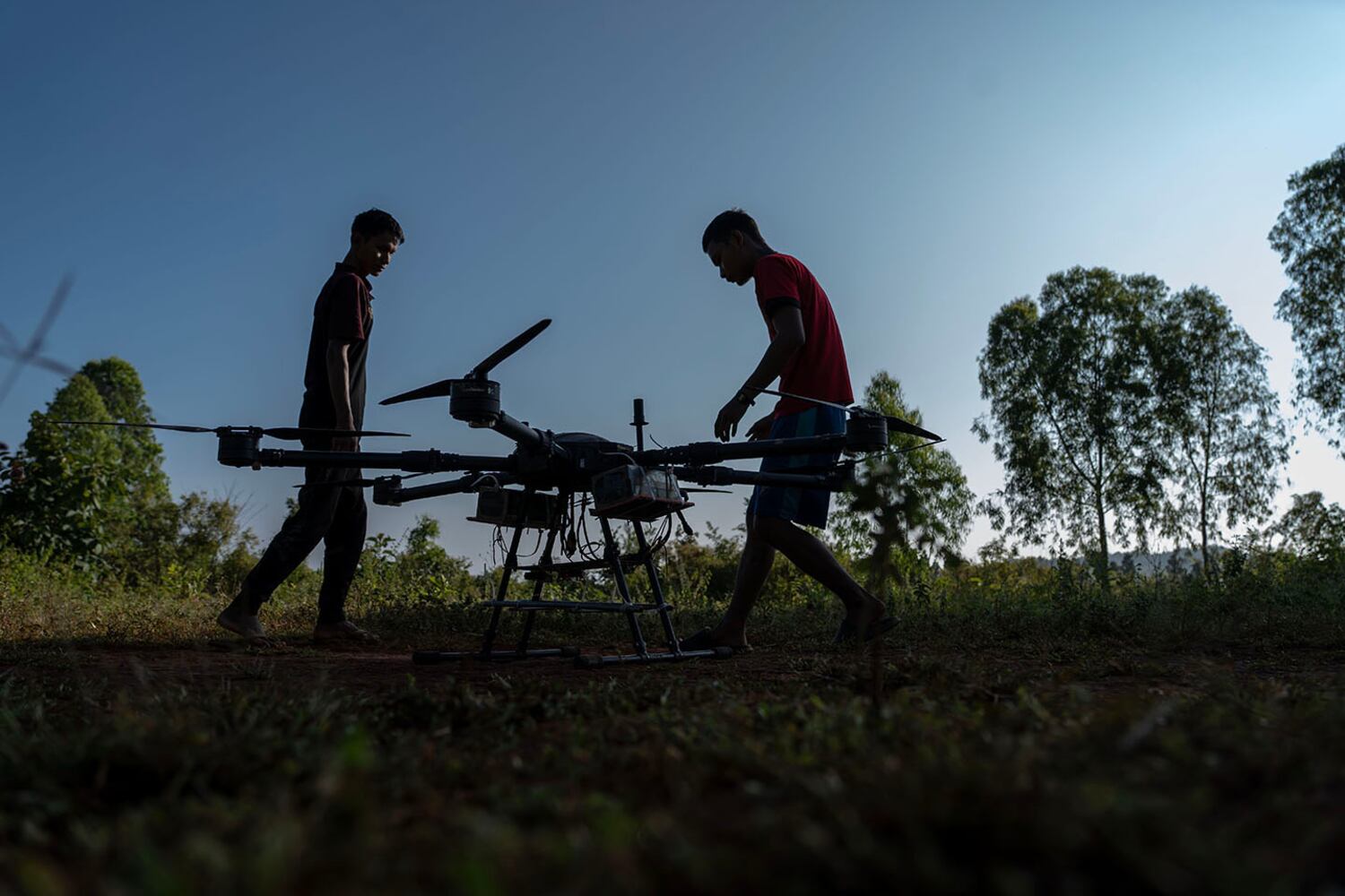 KNDF technicians prepare to test a drone that can carry four 60 kg (130 pound) bombs in Demoso, Kayah state, Myanmar, Nov. 2, 2024.