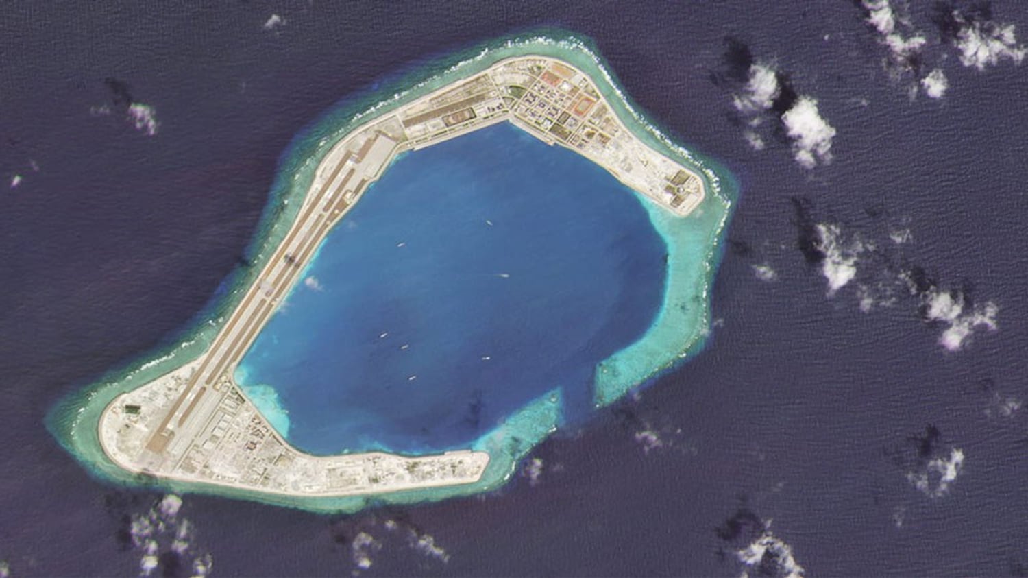 A satellite image taken Feb. 28, 2020 shows vessels at Subi Reef, an artificial island constructed by China in the Spratly island chain in the South China Sea. 