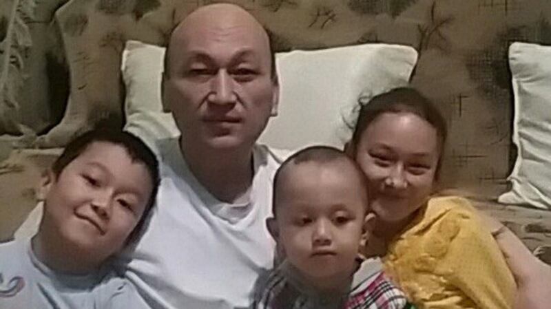 Omurbek Eli with his children in Kazakhstan following his release from detention in China, 2017.