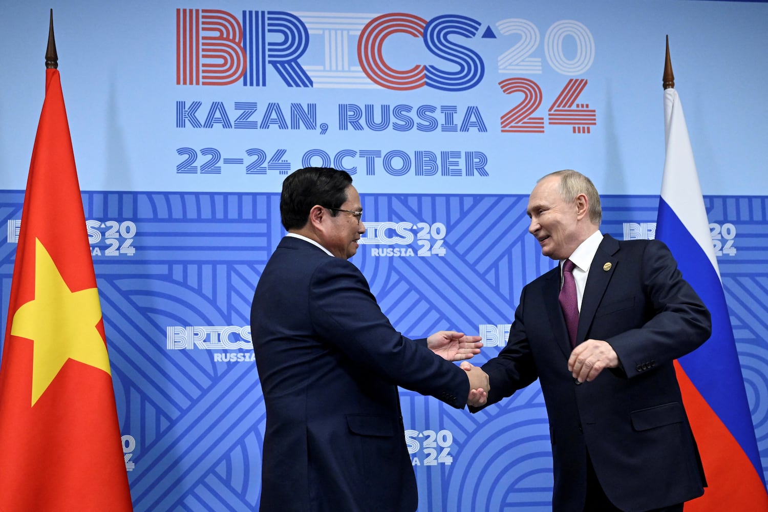 Russian President Vladimir Putin (R) shakes hands with Vietnamese Prime Minister Pham Minh Chinh during a meeting on the sidelines of the BRICS summit in Kazan, Russia Oct. 24, 2024.
