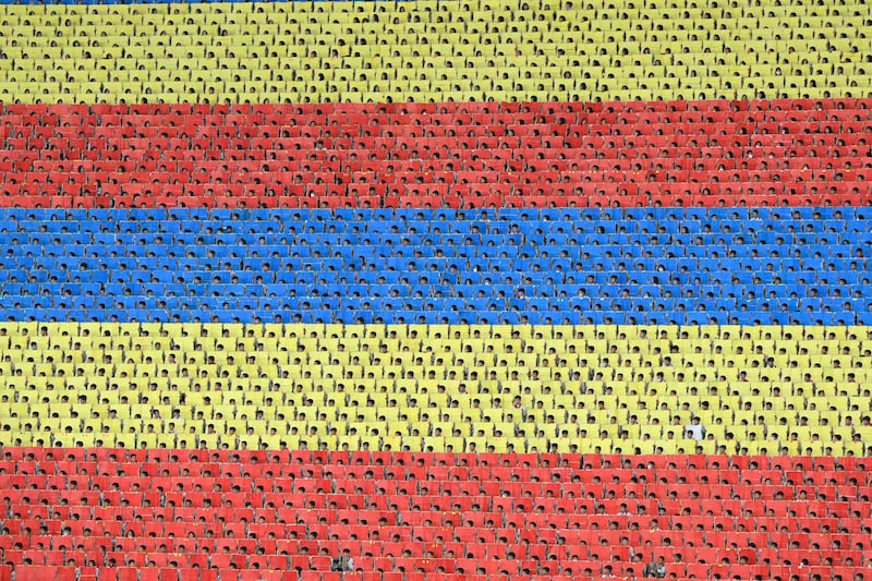 Colored cards are held up from the stands of the May Day stadium during celebrations the 80th founding anniversary of the Workers' Party in Pyongyang, North Korea, Oct. 9, 2025.