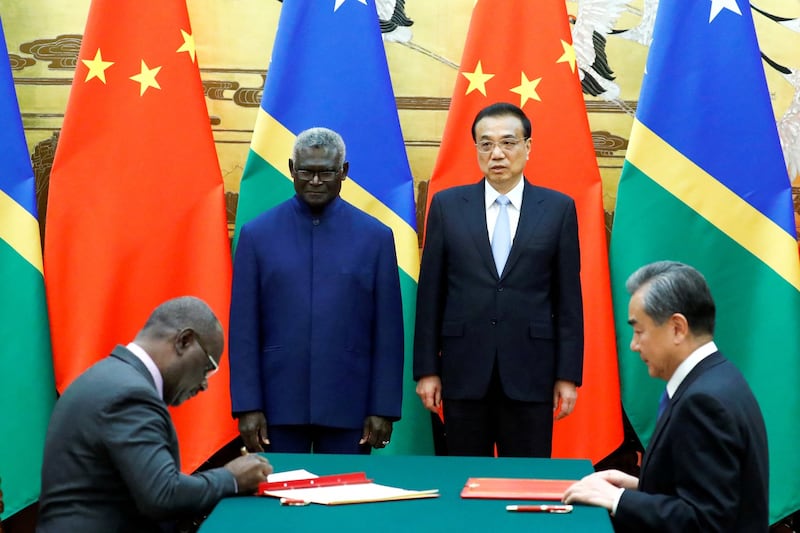 (L-R) Solomon Islands Prime Minister Manasseh Sogavare, Solomon Islands Foreign Minister Jeremiah Manele, Chinese Premier Li Keqiang and Chinese State Councillor and Foreign Minister Wang Yi attend a signing ceremony at the Great Hall of the People in Beijing, China October 9, 2019.