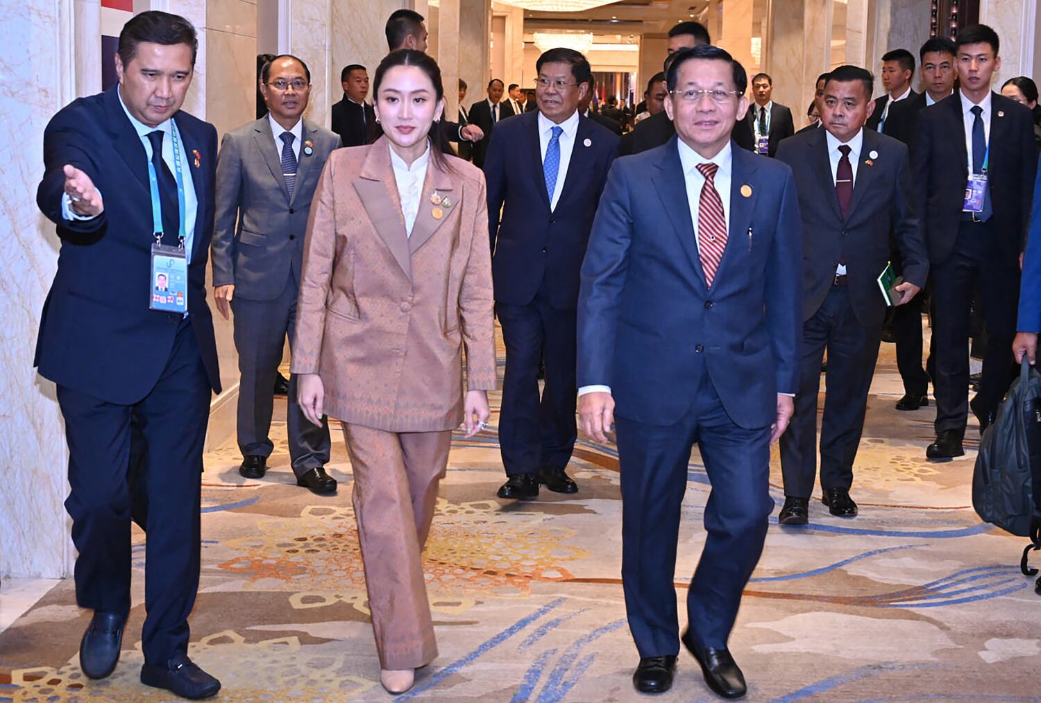 Myanmar's military chief Min Aung Hlaing, right, walking with Thailand's Prime Minister Paetongtarn Shinawatra  in Kunming, China, Nov. 7, 2024.