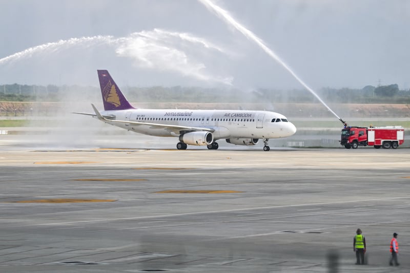 An Air Cambodia Airbus A320-232 is given a water cannon welcome upon its arrival on the inauguration day of the newly built Techo International Airport in Kandal province, on the outskirts of Phnom Penh, Sept. 9, 2025.