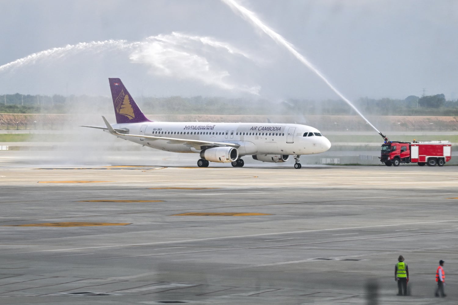 An Air Cambodia Airbus A320-232 is given a water cannon welcome upon its arrival on the inauguration day of the newly built Techo International Airport in Kandal province, on the outskirts of Phnom Penh, Sept. 9, 2025.