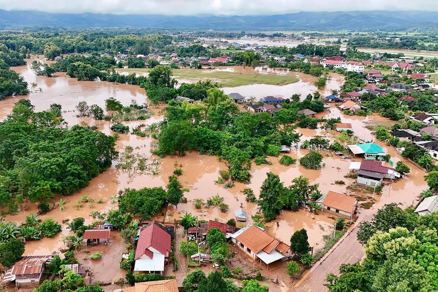 The flood waters surround houses in the province of Luang Namtha, Laos, following heavy rains following the Typhon Yagi, September 11, 2024. (Nationale Lao Radio via AFP)