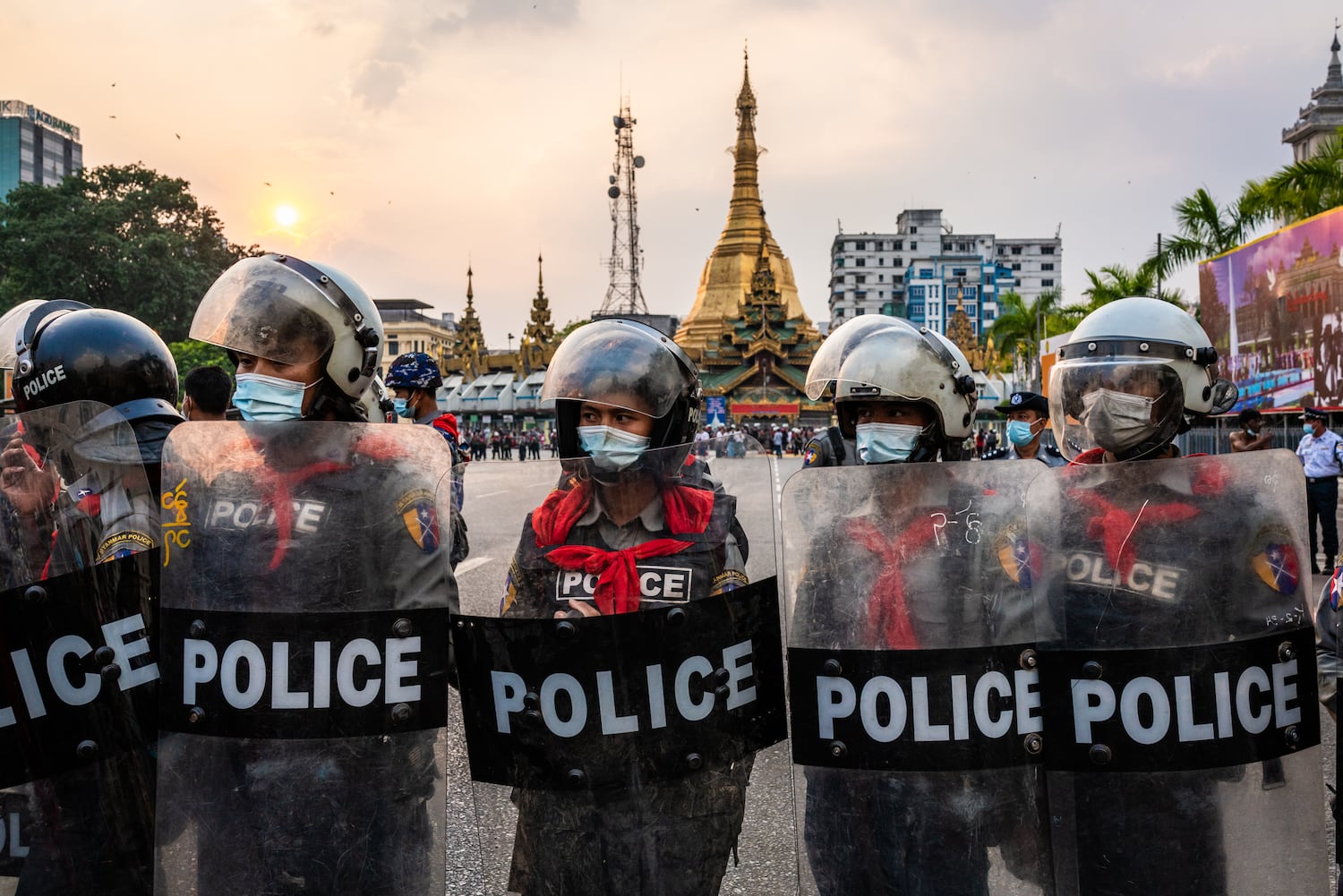 Riot police man a barrier in front of the Yangon City Hall on February 6, 2021 in Yangon, Myanmar. 