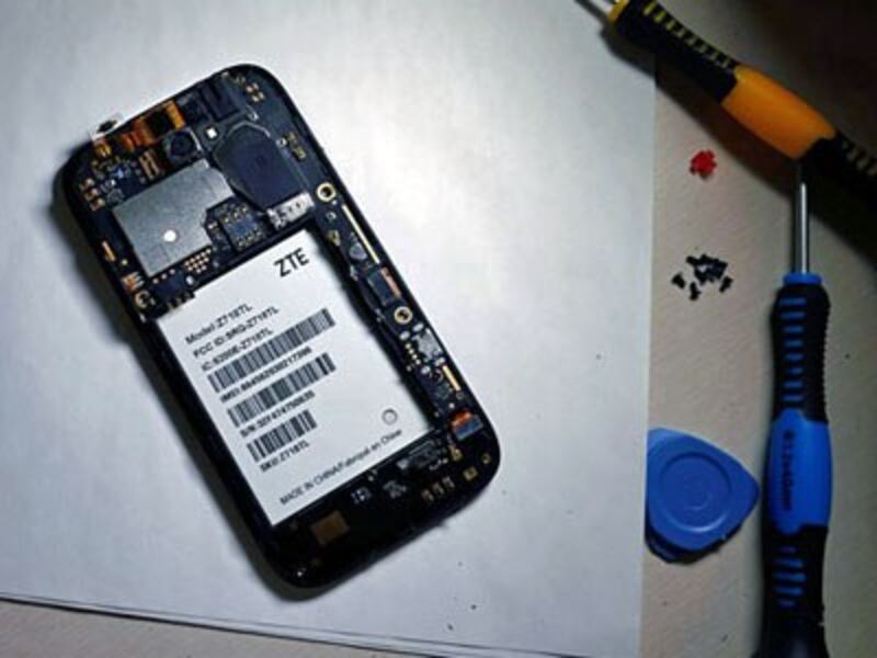 The inside of a ZTE smartphone is pictured in a photo illustration, April 17, 2018. 