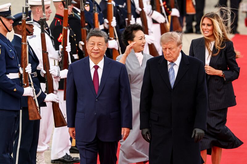 U.S. President Donald Trump and U.S. first lady Melania Trump walk with China's President Xi Jinping and his wife Peng Liyuan upon their arrival at Joint Base Andrews, Maryland, Sept. 23, 2026.