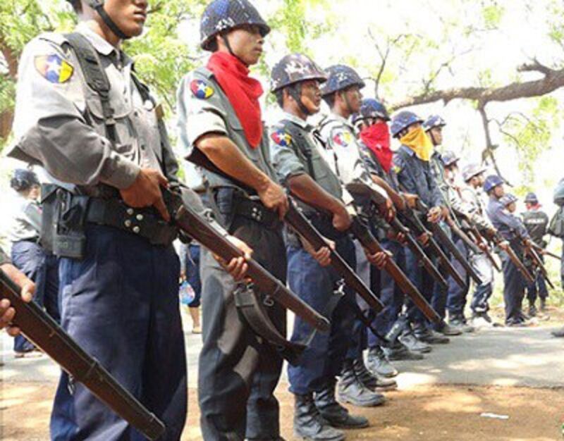 Police stand ready with shields and guns to stop the protesters, April 26, 2013. Photo credit: RFA.