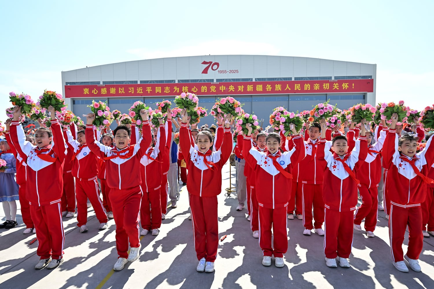 In this Chinese government image that could not be independently verified, President Xi Jinping is welcomed at the Urumqi airport, Xinjiang Uyghur Autonomous Region, Sept. 23, 2025. (Yan Yan/Xinhua via Getty Images)