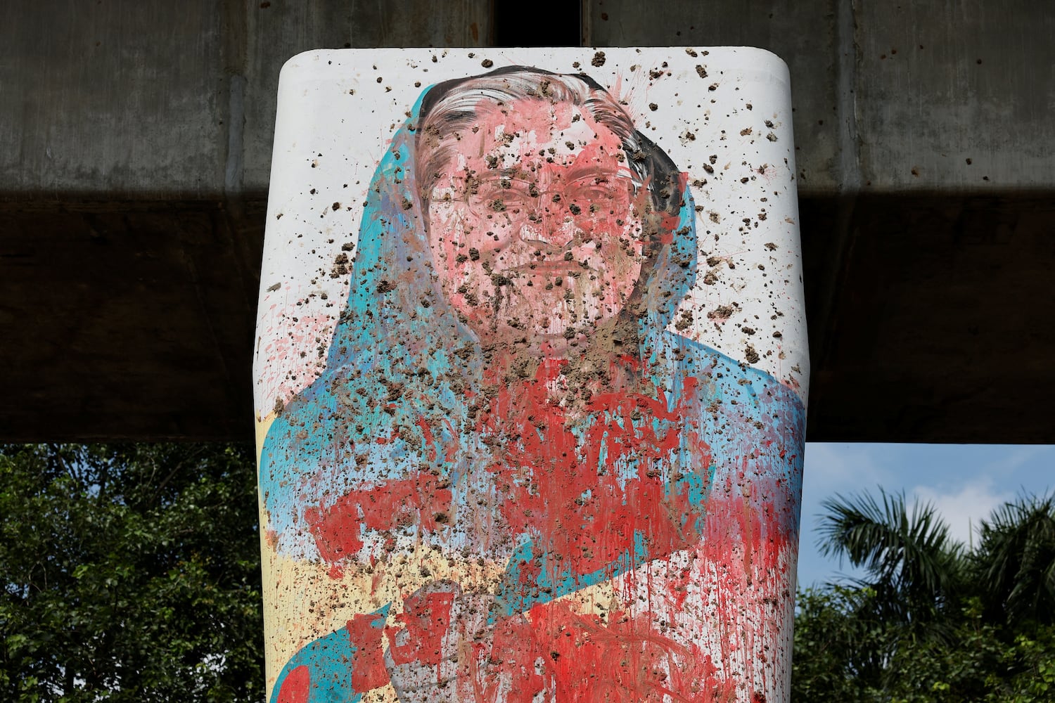 A mural of former Bangladesh Prime Minister Sheikh Hasina is seen vandalized by protesters days before in Dhaka, Aug. 5, 2024. [Mohammad Ponir Hossain/Reuters]